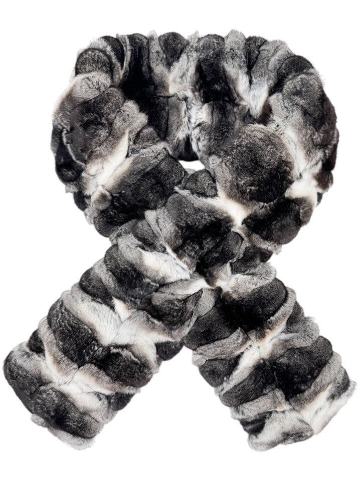 Elegant chinchilla fur scarf lies on white background, luxury fashion accessory perfect for winter weddings, evening events, and luxury gifting.