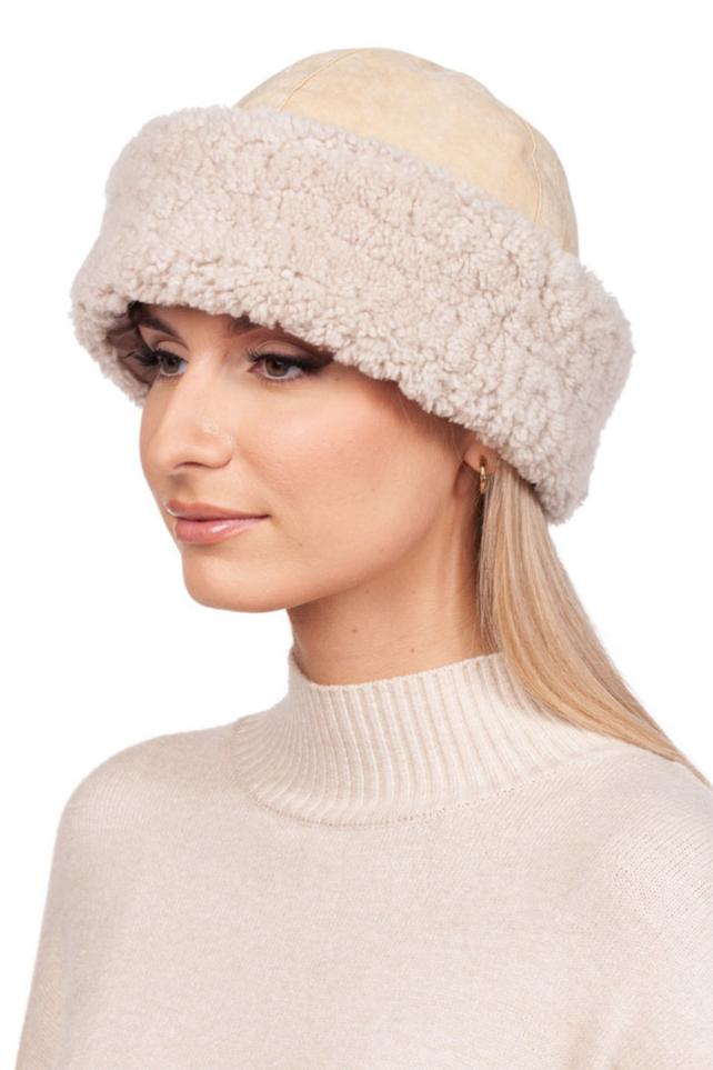 A person is shown in side profile wearing a luxurious FurbySD Beige Shearling Fur Roller Hat, featuring a wide and fluffy band, complemented by a matching sweater. The individual has long, straight hair and is photographed against a white background.