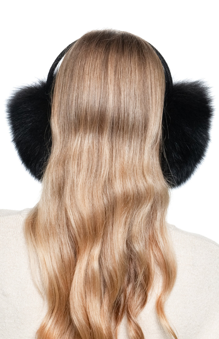 Back view of handmade black fox fur earmuffs with wide knitted headband, fluffy winter accessory for women.