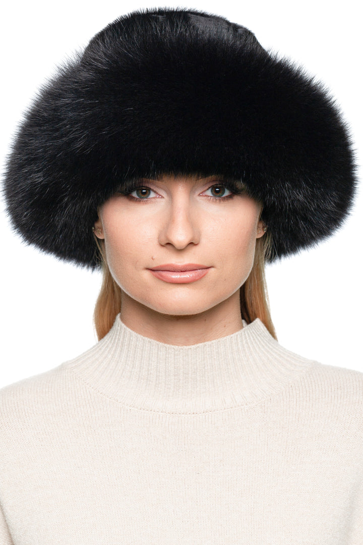 Close-up of a model wearing a luxurious Black Fox And Pony Fur Fedora Hat with a wide fur brim, showcasing elegance and warmth.