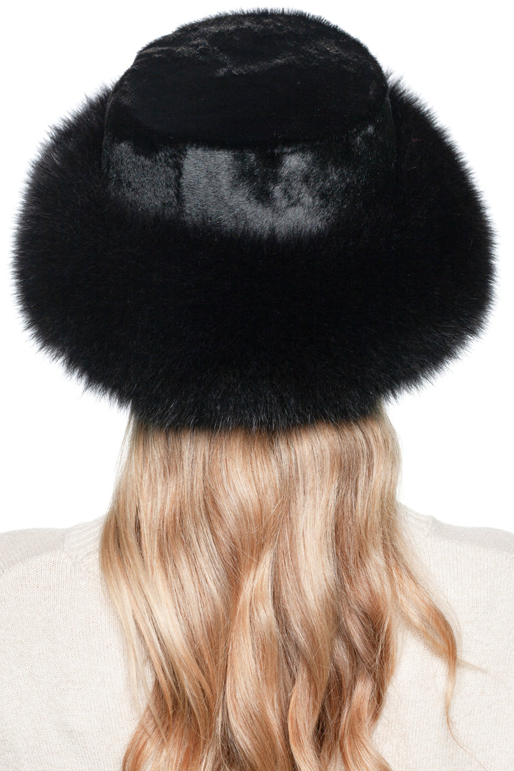 Back view of a luxurious Black Fox Fur Hat with a wide fox fur trimmed brim and shiny black pony fur on top and crown perfect for cold weather and stylish warmth.