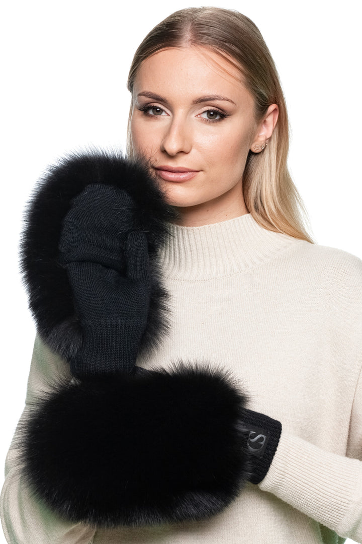 Pair of black fox fur convertible mittens, warm fluffy winter gloves with fingerless option, designed for women seeking luxury and practicality.