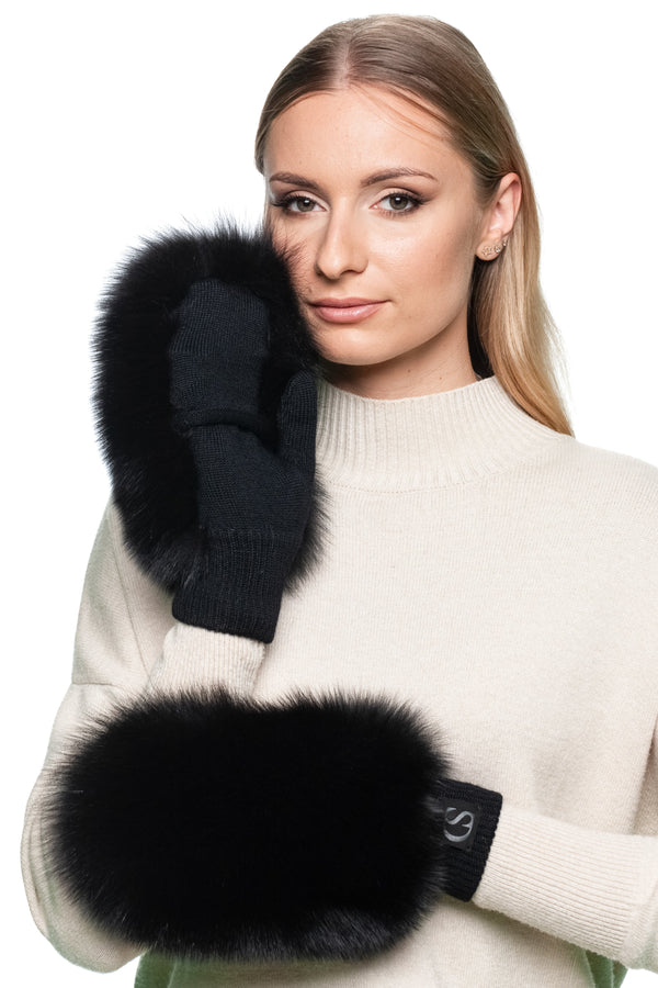 Model showing fingerless black wool gloves with fox fur cuffs, convertible mittens ideal for texting, driving, and everyday winter wear.