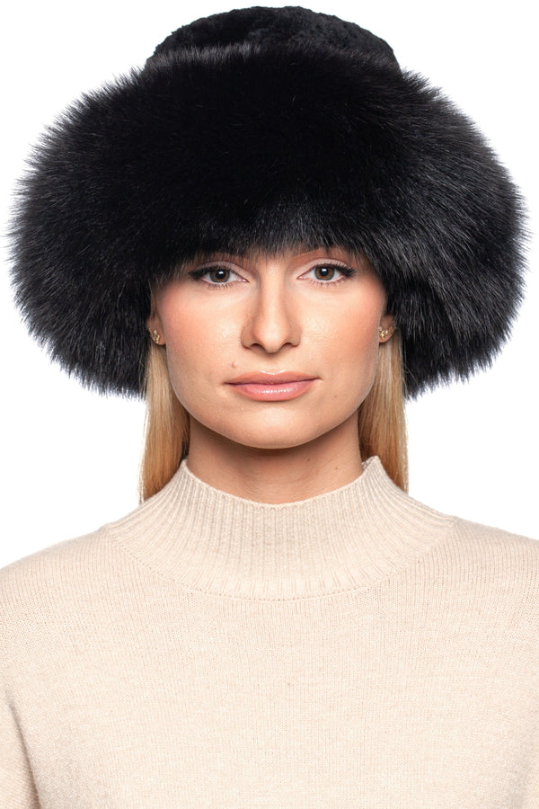 Close-up of a model wearing a luxurious Black Fox Fur Panama Hat with a wide fur brim, showcasing elegance and warmth.