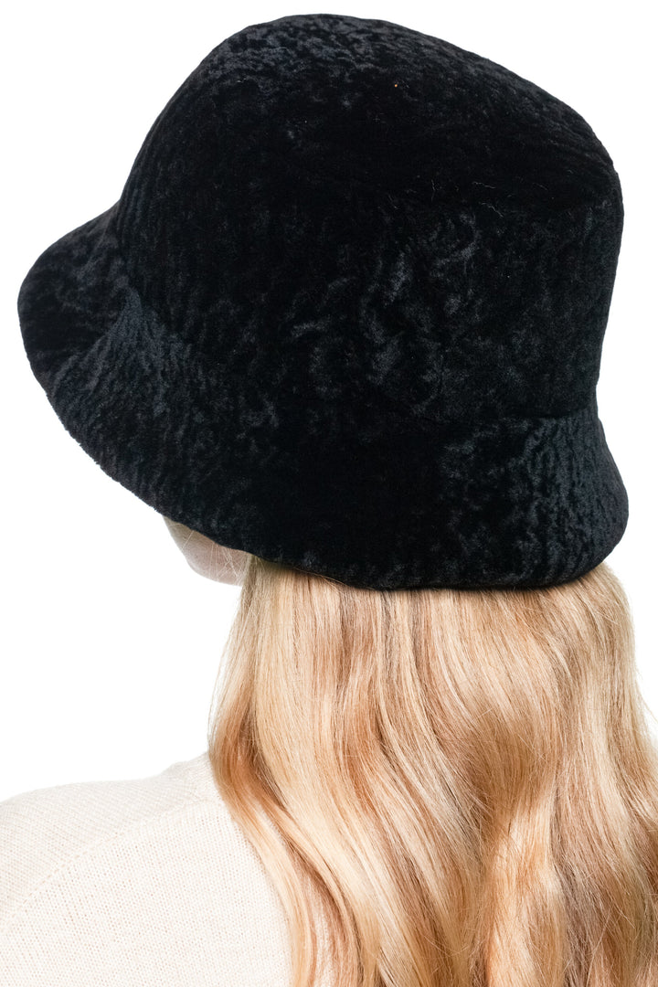 Back angle of black lamb fur fisherman hat, real sheepskin bucket style with rolled brim, unisex warm winter fur cap.