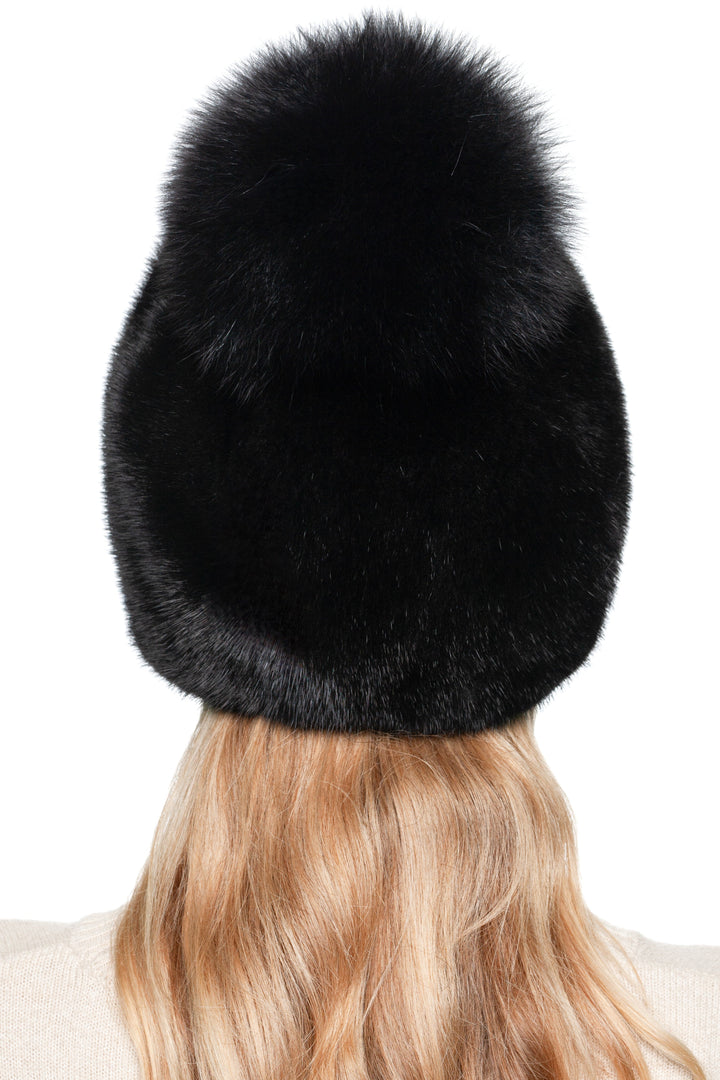 Back view of black mink fur beanie hat with oversized fox fur pom pom – handmade luxury winter hat for women by FurbySD.