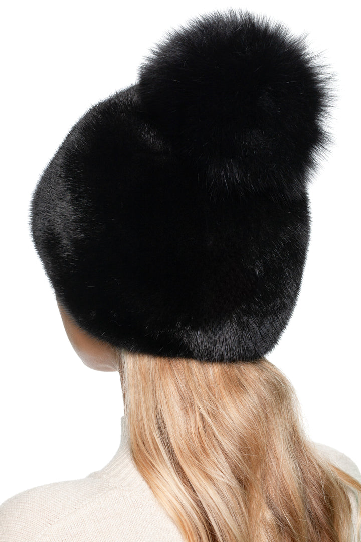 Black mink fur beanie hat with fox fur pom pom – handmade luxury women’s winter hat, rear angled view showing fur texture.