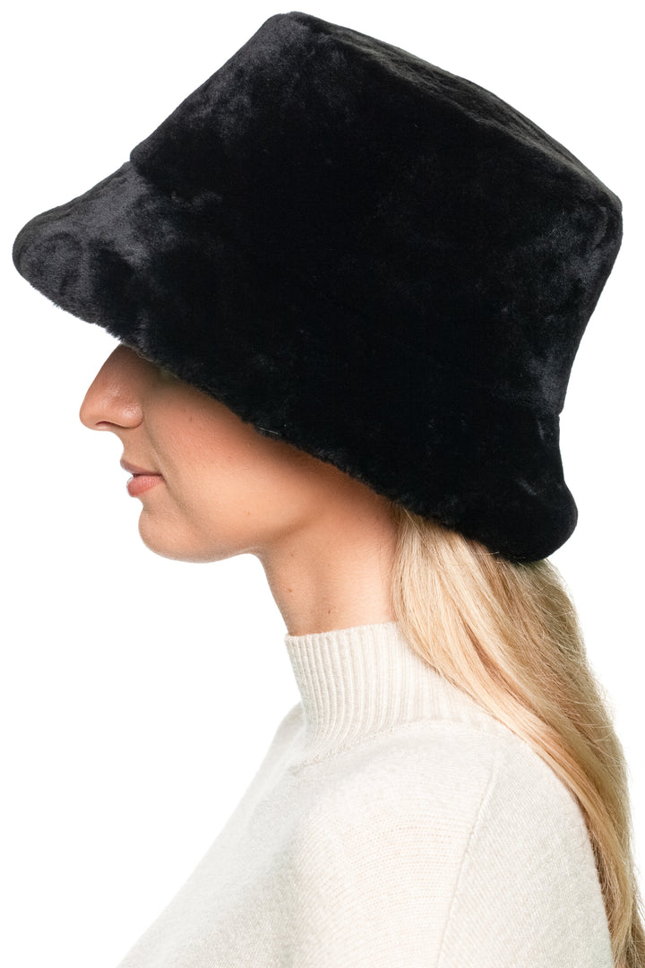 Side view of Black Mouton Lamb Fur Bucket Hat, soft genuine lamb fur plush hat for women, chic and warm winter fashion piece.