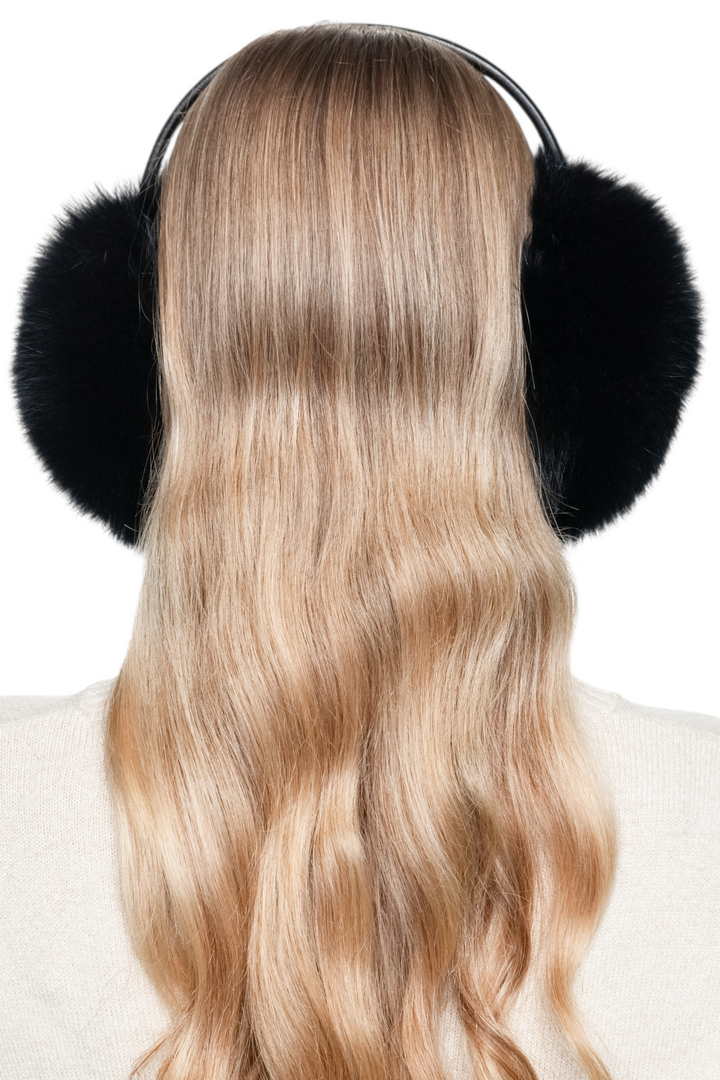 Back view of handmade black fox fur earmuffs, elegant fluffy winter accessory keeping ears warm and stylish.