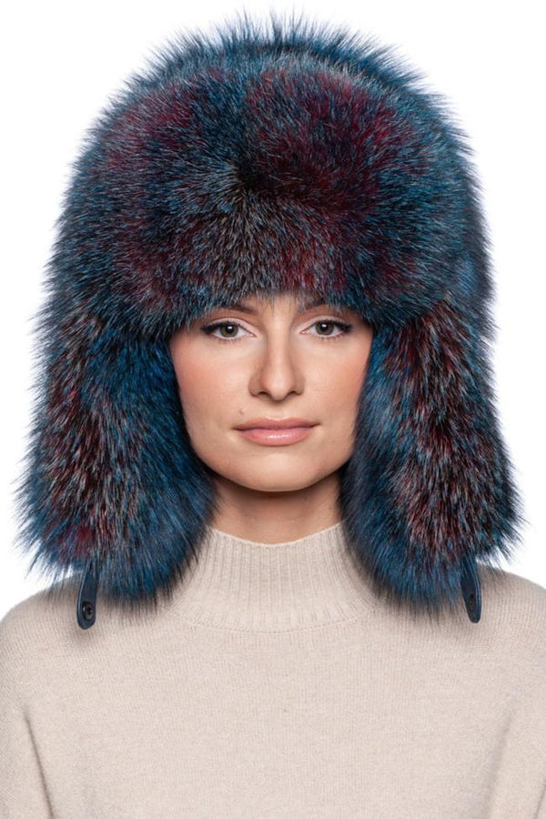 Blue Fox Fur Ushanka Hat featuring vibrant blue and red hues, designed for warmth and style with earflaps.