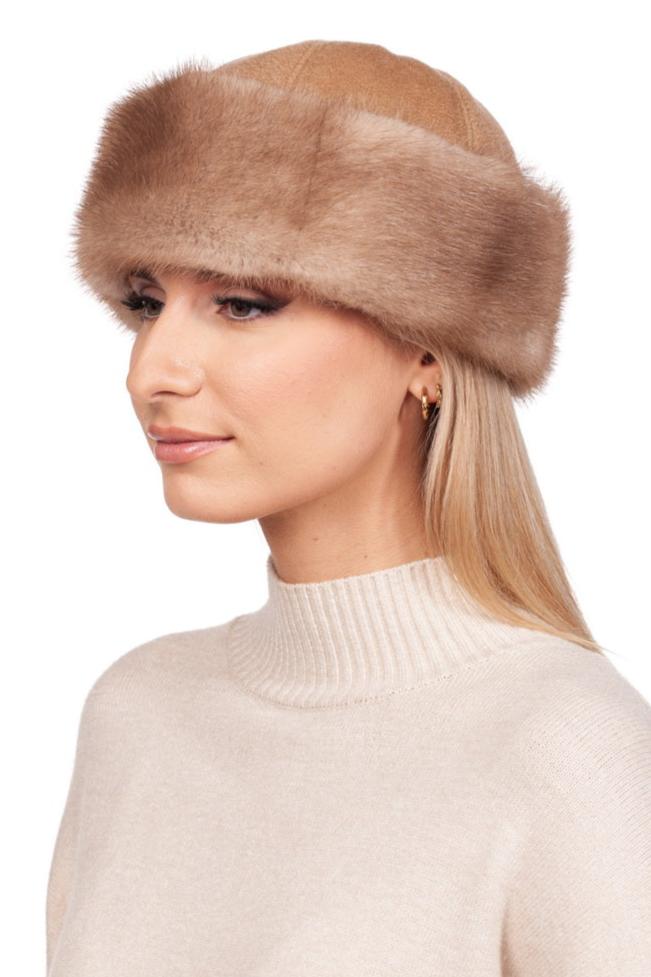 A person wearing a FurbySD Beige Mink Fur Hat and Flip Top Mittens Set, reminiscent of luxury winter accessories, smiles slightly. Their long, straight hair frames the face beautifully against the plain white background.