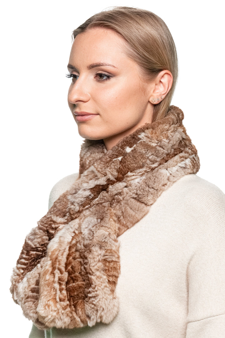 Brown chinchilla fur knitted scarf shown from the back on a woman wearing a cream sweater, demonstrating full scarf coverage around the collar.