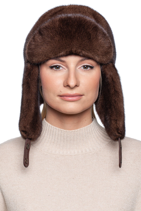 Model wearing a luxurious Brown Mink Fur Ushanka Hat, showcasing its soft texture and stylish design for winter fashion.