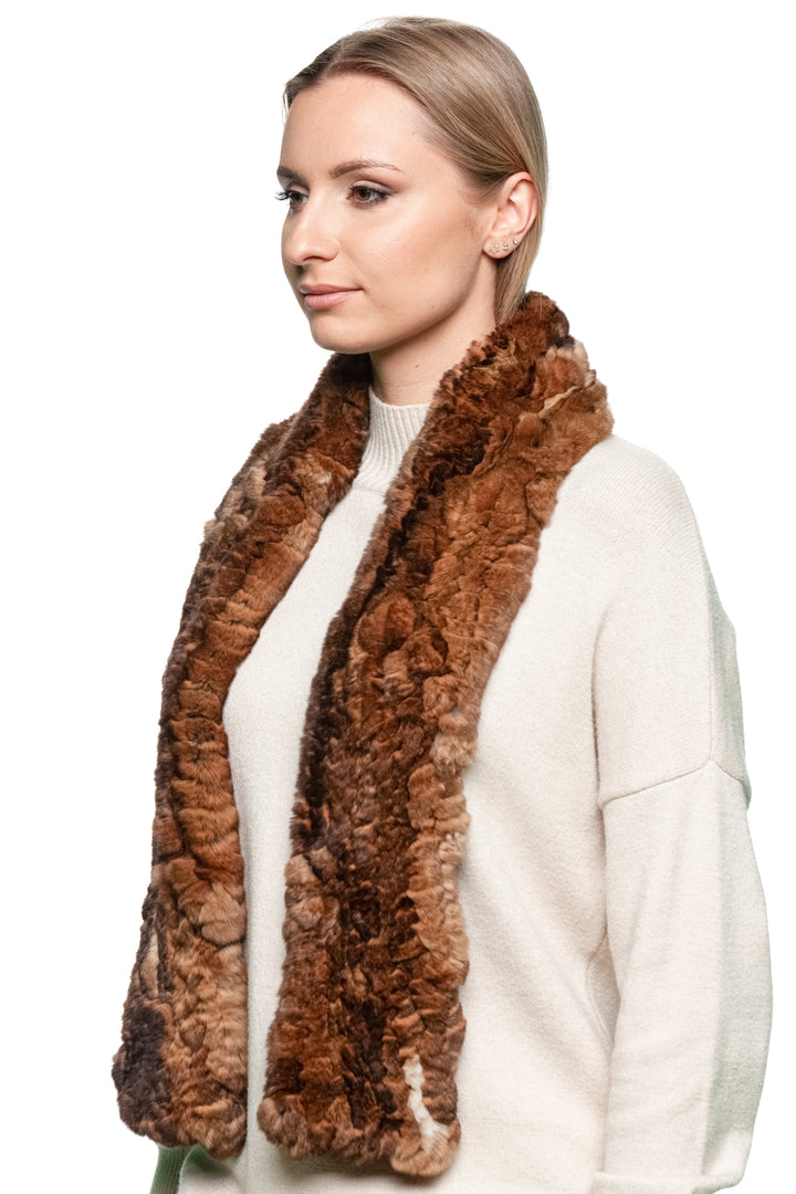 Woman wearing a long handmade brown rex rabbit fur scarf draped over shoulders — luxury soft fur accessory for elegant winter outfits.