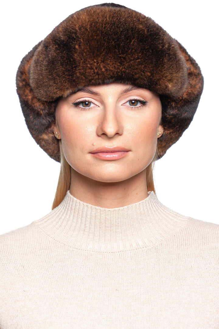 Model wearing a luxurious Brown Lamb and Rex Rabbit Fur Trapper Hat, showcasing stylish winter fashion.