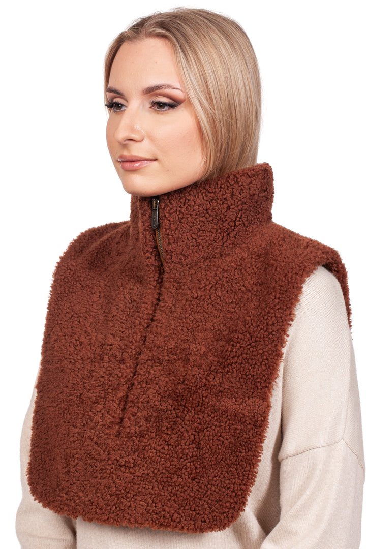 A person wears the FurbySD Brown Shearling Fur Turtleneck Collar over a beige sweater. Their blonde hair is pulled back as they gaze to the side against a white background, highlighting the cozy elegance of this handmade accessory.