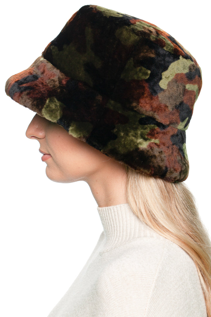 Unisex camouflage shearling bucket hat made of real lambskin fur, shown from the side – cozy winter outdoor headwear with camo print.