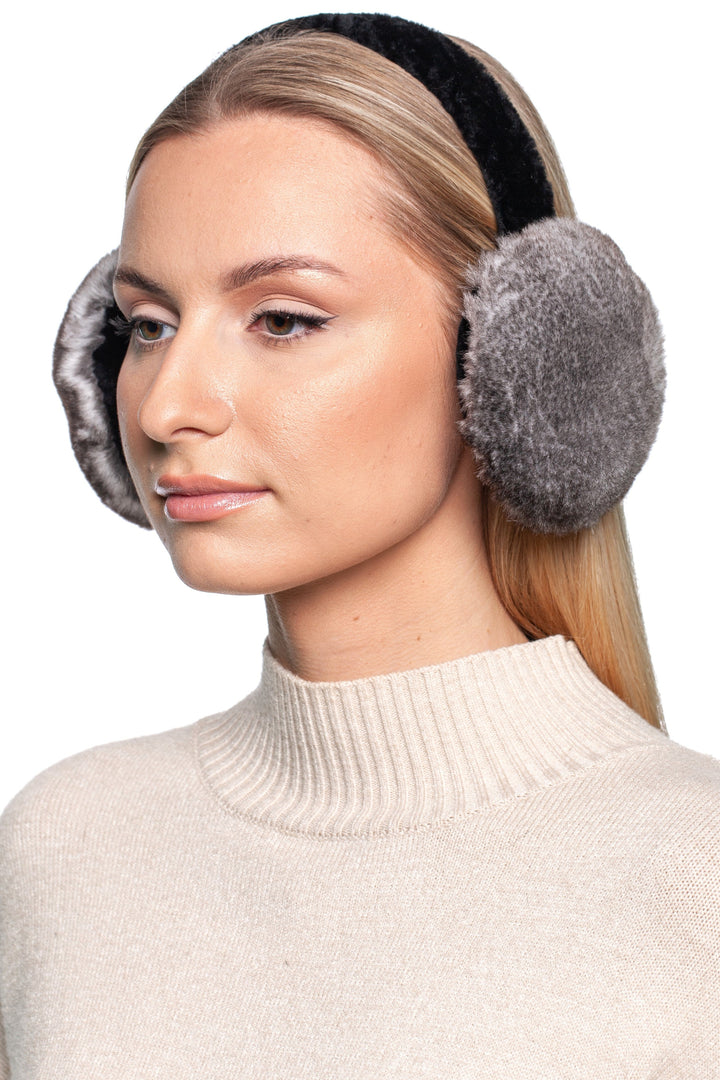 Model showcasing grey rex rabbit fur earmuffs from a side angle, highlighting the soft fur texture and comfortable fit. A perfect blend of warmth and style for winter.