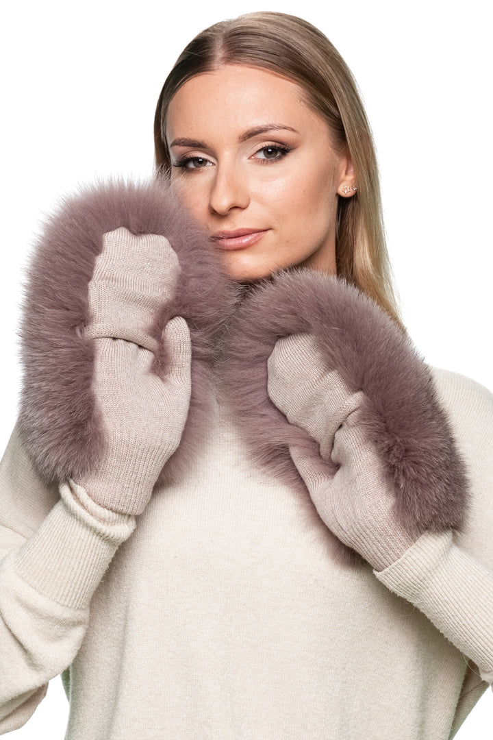 Woman wearing dusty pink fox fur flip top mittens, luxury fingerless wool gloves with real fur, elegant winter fashion accessory.