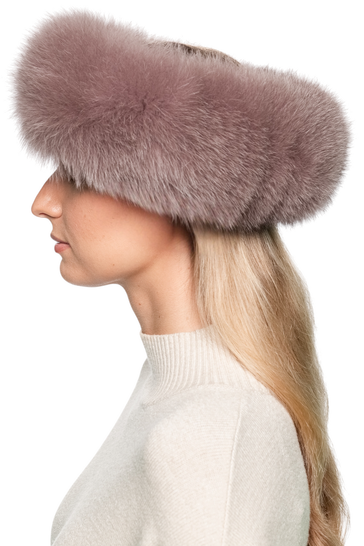 Luxury dusty pink fox fur headband, handmade wide fur band shown from side angle on model with long blonde hair, elegant winter accessory.