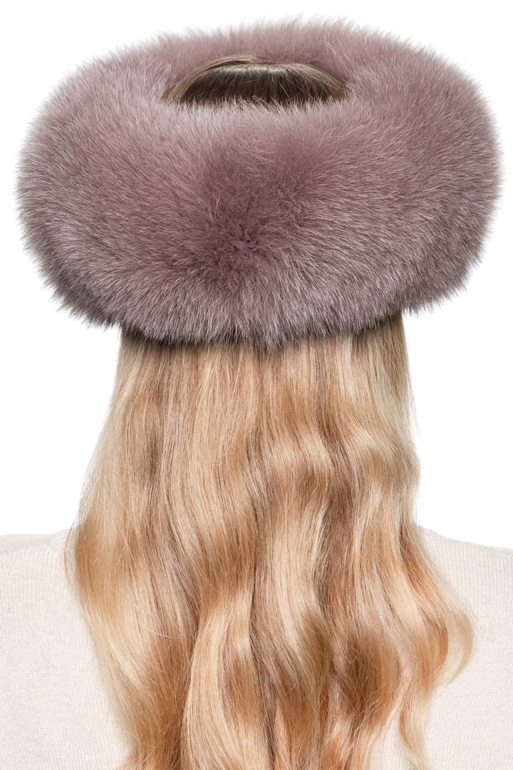 Oversized dusty pink fox fur headband, fluffy real fox fur ear warmer displayed on model with wavy blonde hair, perfect for cold weather style.