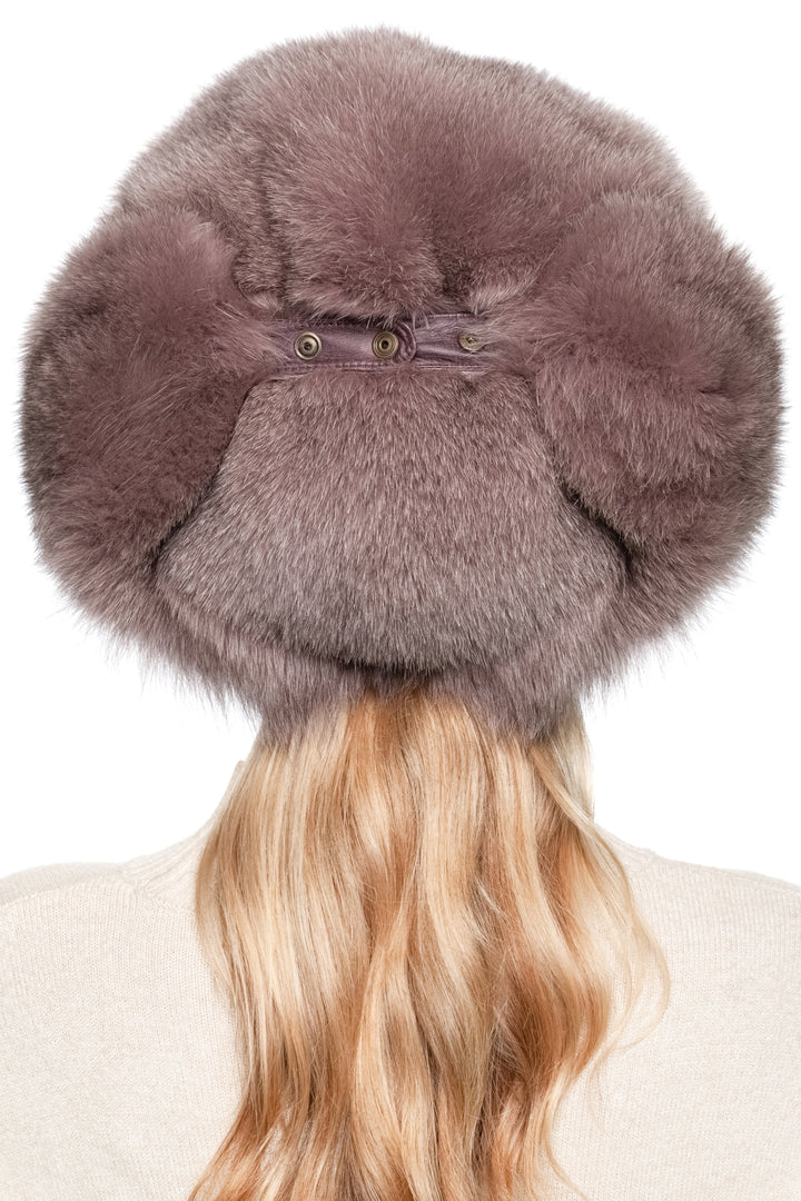 Rear view of real dusty pink fox fur trapper hat showing adjustable strap and thick fluffy crown, luxury women’s winter ushanka hat.