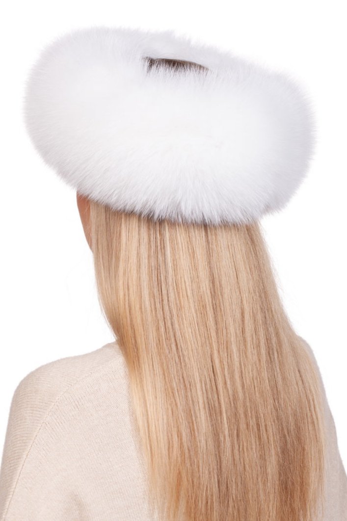 A person with long, blonde hair is seen from the back wearing the White Fox Fur Mittens And Headband Set by FurbySD. Their ensemble includes a fluffy headband and a light-colored sweater, elegantly complemented by their winter accessories against a plain background.