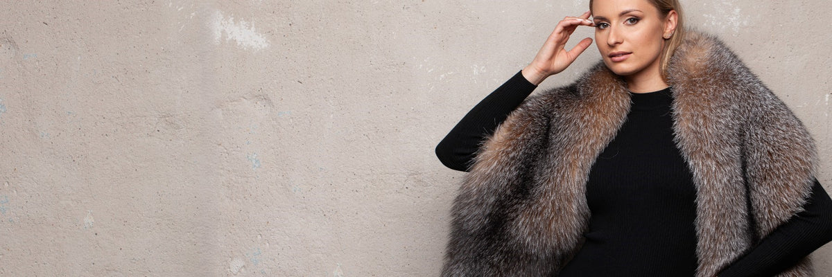 Amber fox fur stole worn with a black dress