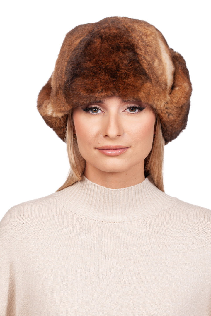 Brown Rex Rabbit Fur Ushanka Worn By Blond Woman Wearing Beige Sweater.