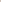 Gray knit beanie with a fur pom-pom worn by a person on a white background