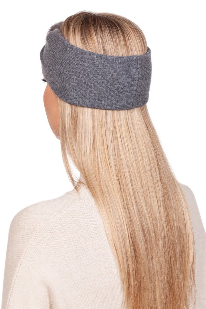 Rear view of a person with long blond hair wearing the Grey Cashmere Headband with Mink Fur by FurbySD handcrafted in Lithuania, paired with a cream-colored sweater. The individual is facing away, showcasing their hairstyle and the texture of the headband.