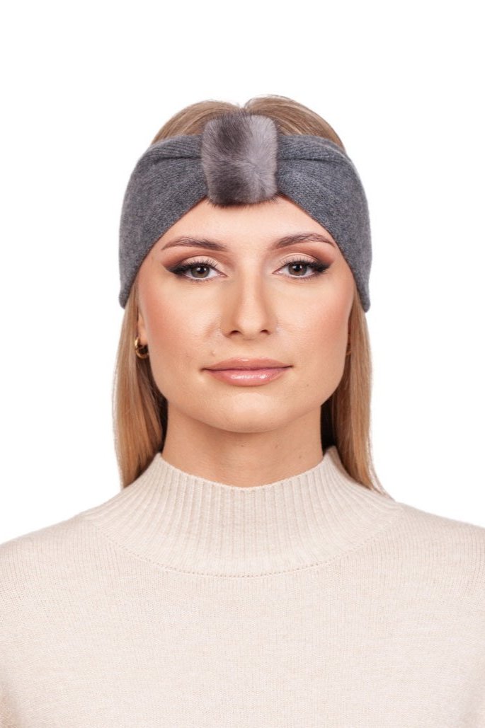 Against a plain white background, a person with long hair wears the Grey Cashmere Headband with Mink Fur by FurbySD, paired with a cream turtleneck sweater.