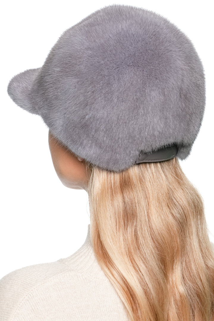 Back view of grey mink fur baseball cap showing adjustable strap — real fur winter fashion accessory.