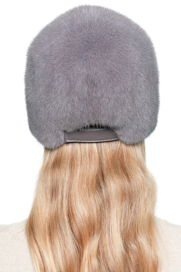 Full back profile of grey mink fur baseball cap — warm unisex fur hat with sporty design.