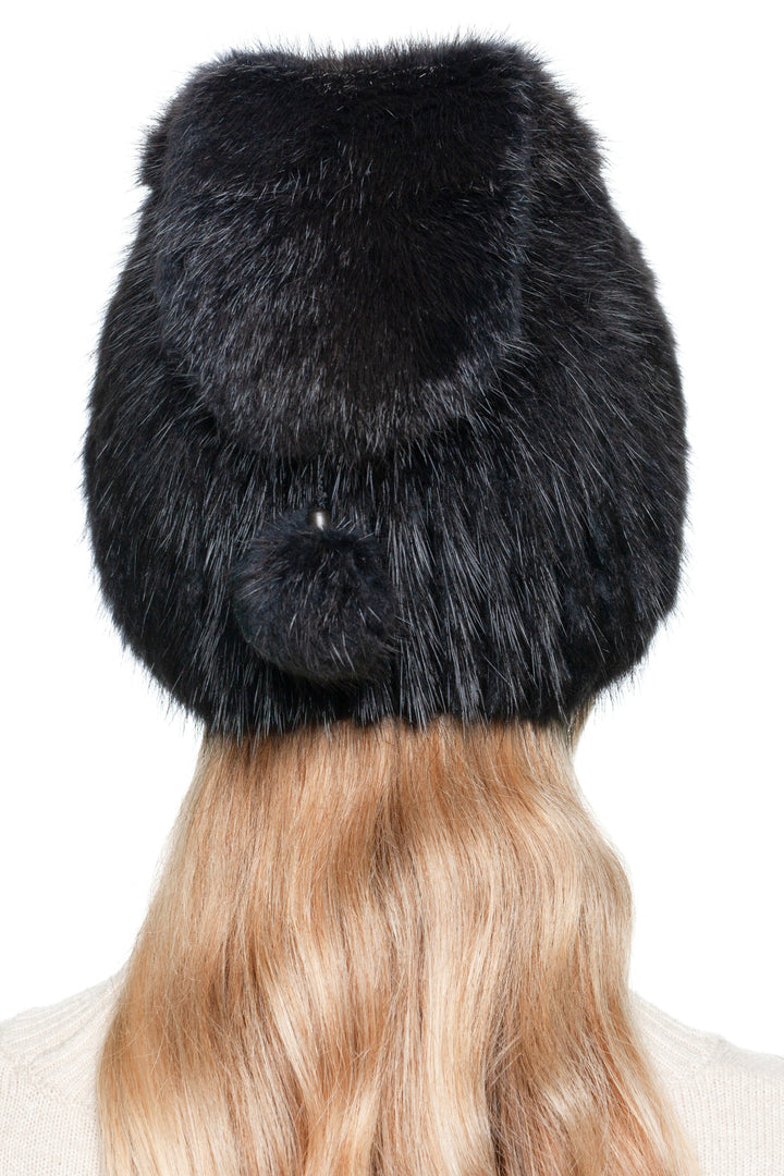 Back view of grey muskrat fur beanie with pom pom, showing luxury knitted fur texture.