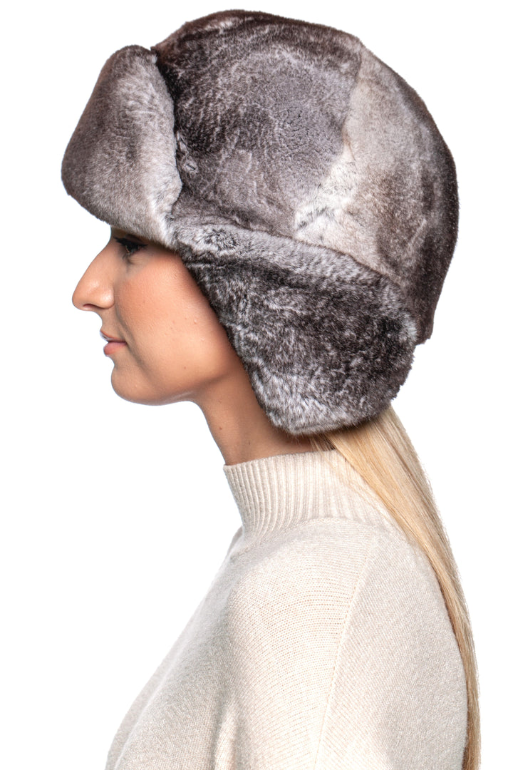 Stylish woman wearing a luxurious Grey Rex Rabbit Fur Ushanka Hat, showcasing its plush fur and traditional design.