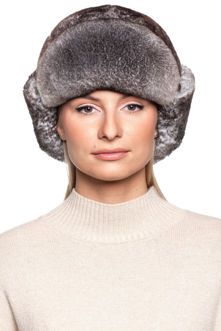 Woman wearing a luxurious grey Rex Rabbit Fur Ushanka hat, showcasing its elegant design and plush texture.