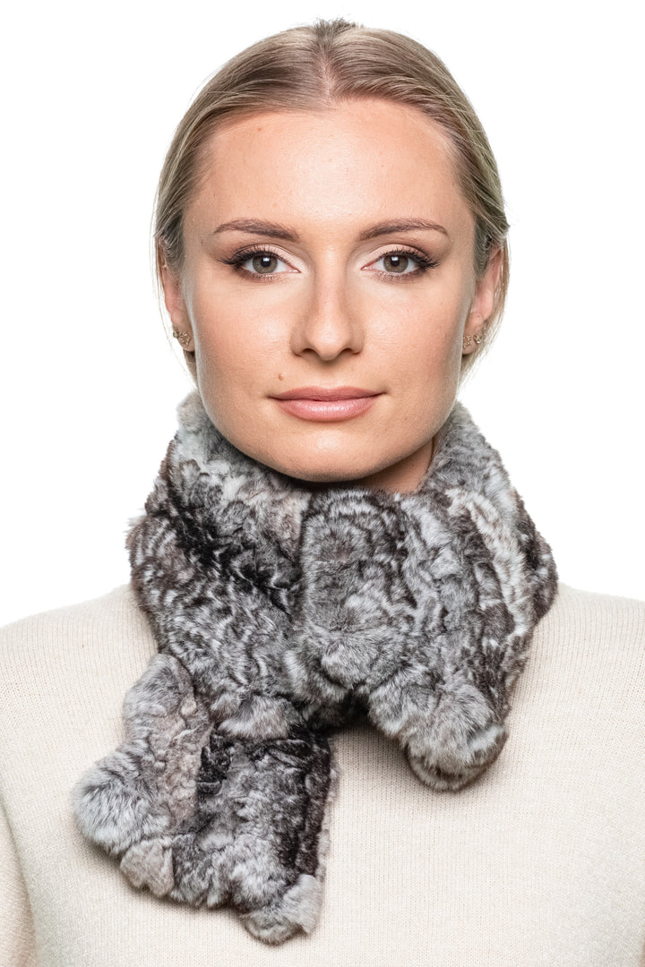Front view of woman wearing hand-knitted grey Rex rabbit fur scarf crossed and looped, fluffy winter fashion accessory.