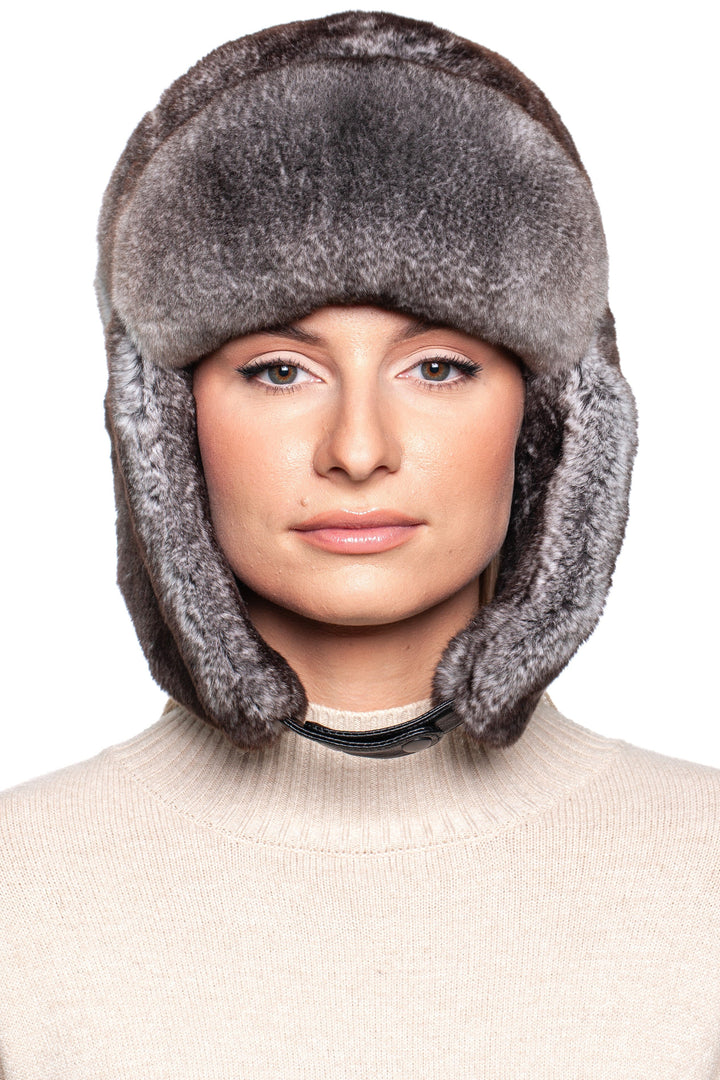 Model wearing a luxurious Grey Rex Rabbit Fur Ushanka Hat with earflaps for stylish winter warmth.