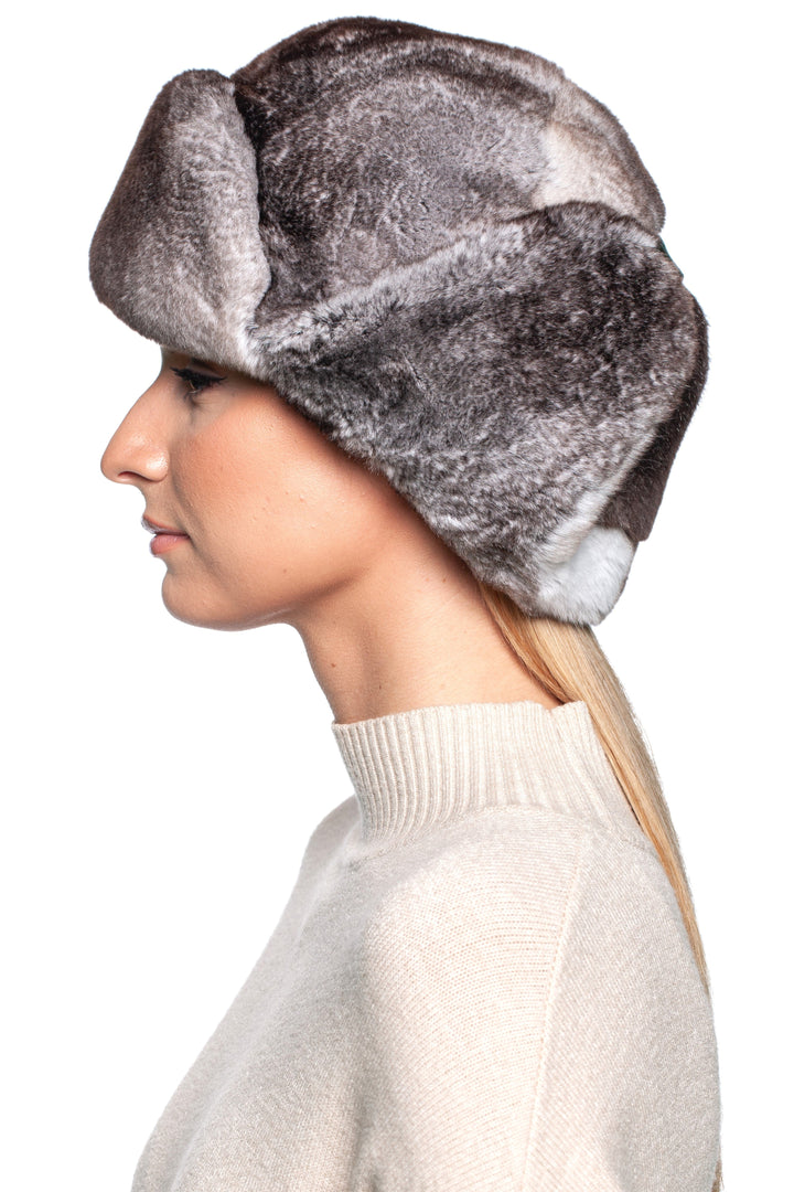 Profile view of a woman wearing a luxurious Grey Rex Rabbit Fur Ushanka Hat, showcasing its soft texture and classic design.