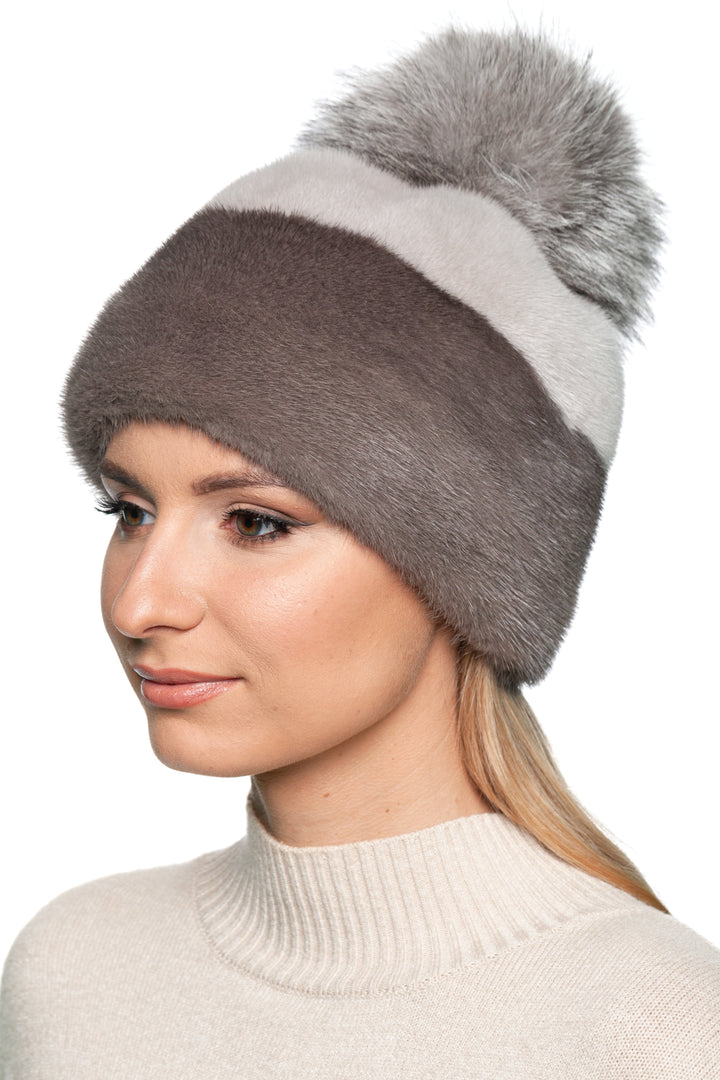 Elegant striped mink fur beanie in grey and brown shades, topped with a plush silver fox pom pom, handmade winter accessory.