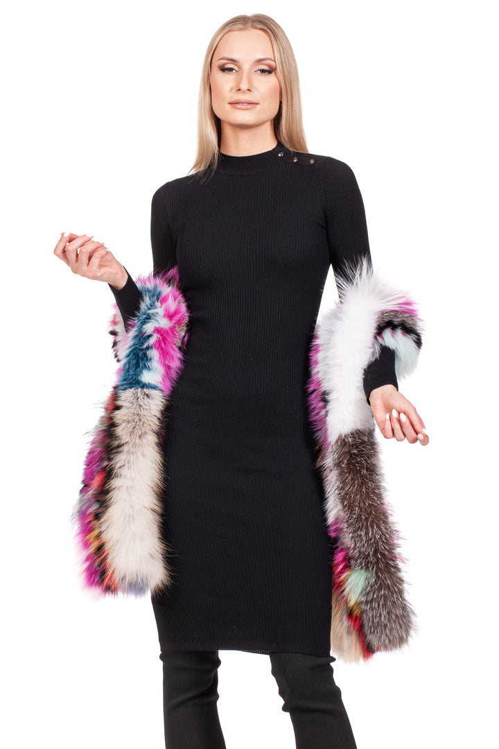 A person wearing a black long-sleeve dress holds an elegant Long Knitted Fox Fur Scarf by FurbySD draped over their arms, showcasing vibrant shades of pink, blue, white, and brown against a plain white background.