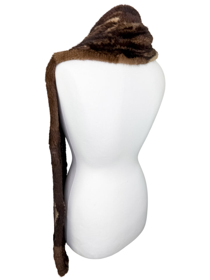 Brown mink fur scarf on a mannequin against a white background