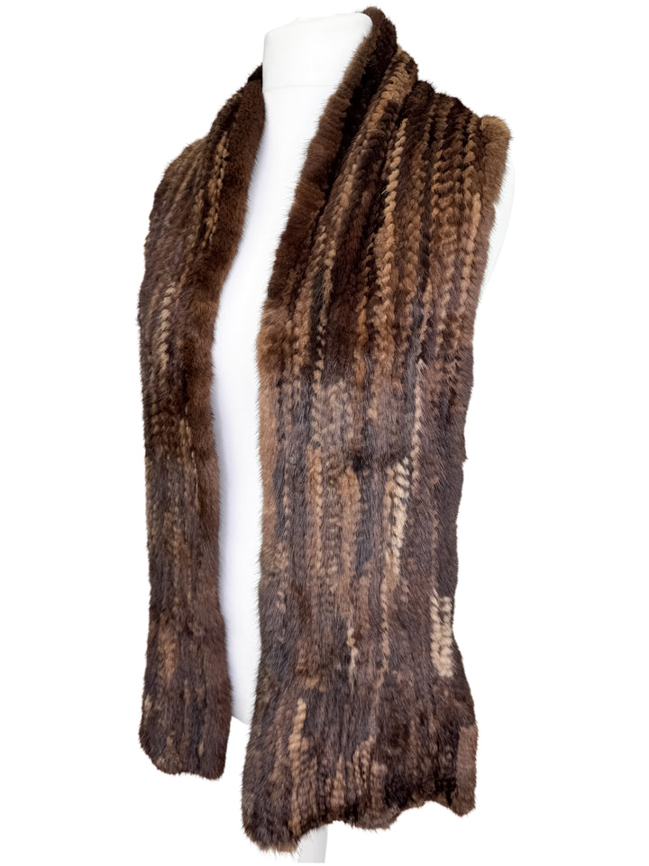 Brown knitted mink fur scarf on a white mannequin