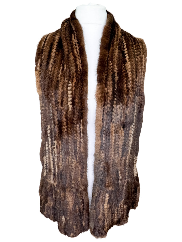 Brown mink fur scarf on a mannequin against a white background