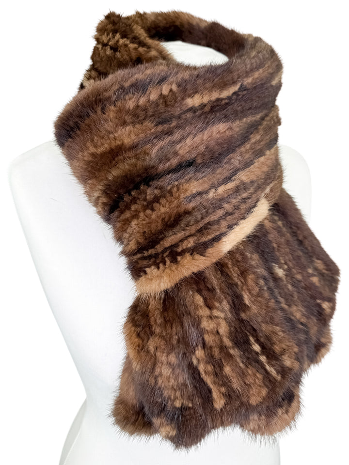 Brown mink fur scarf on a mannequin with a white background