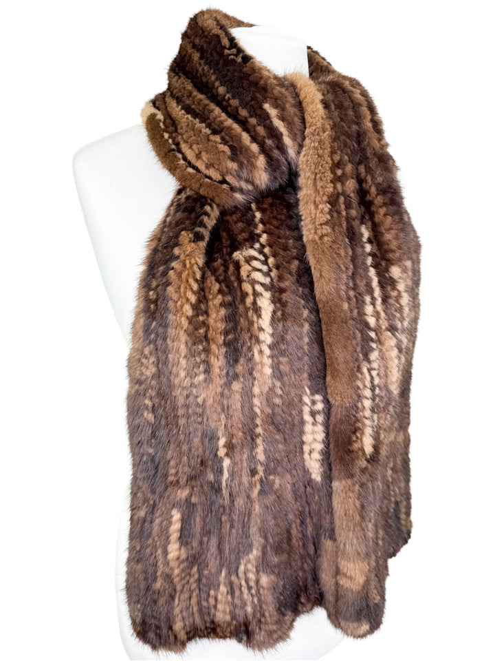 Brown mink fur scarf on a mannequin against a white background
