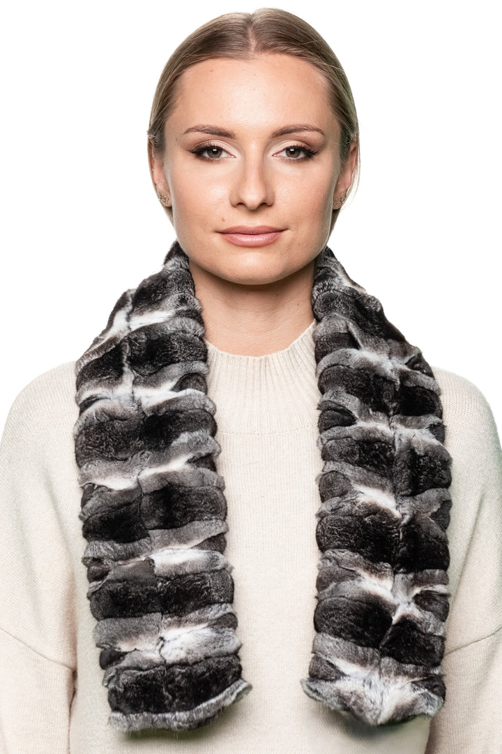Front-facing view of genuine chinchilla fur scarf styled with cream sweater, showcasing reversible design, soft texture, and timeless winter fashion appeal.