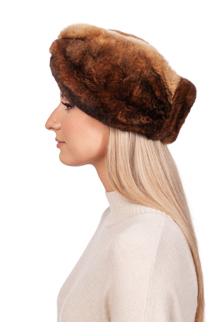 A person with long, light hair is wearing a FurbySD Brown Rex Rabbit Fur Headband. They are wearing a light beige sweater and are depicted in profile against a plain white background.