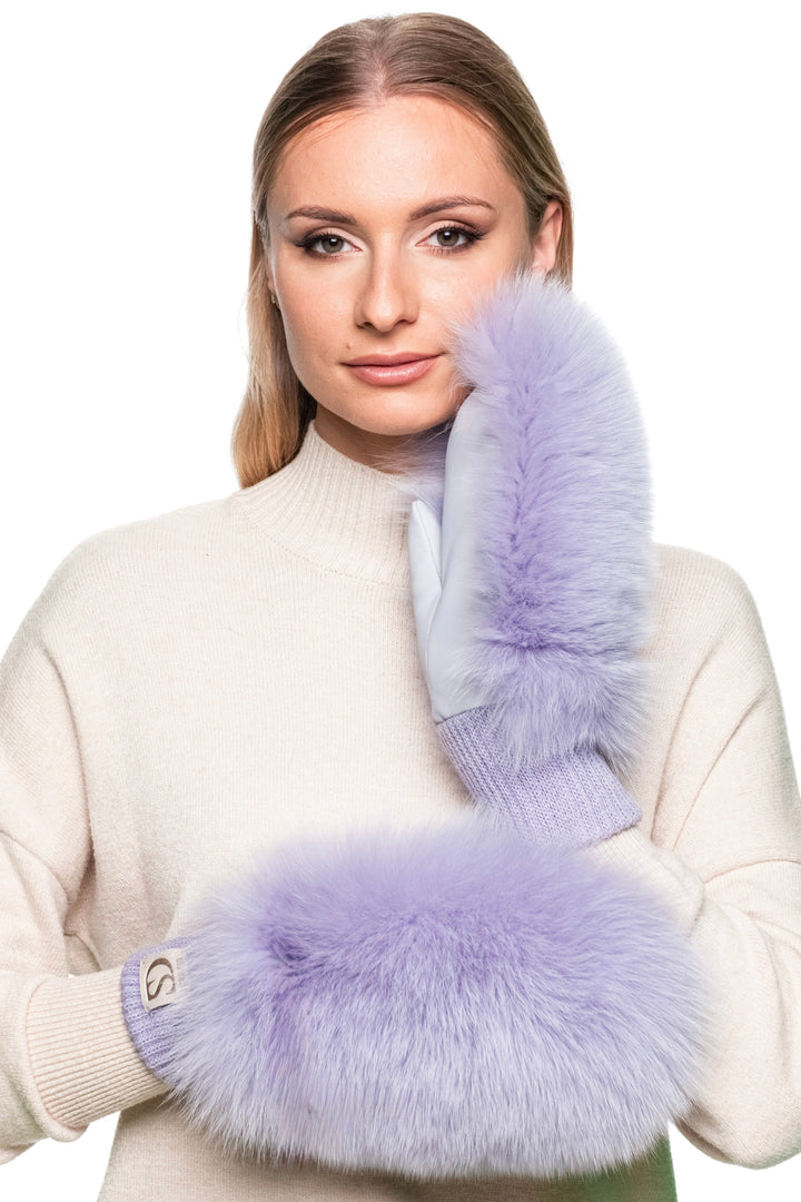 Elegant women’s purple fox fur and leather mittens, fluffy ski gloves for cold weather, luxury winter fashion accessory.
